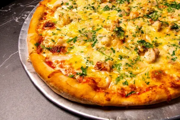 Slice at Evio's Pizza & Grill, Miami Beach – $3 on the menu